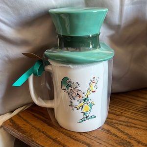 Rae Dunn Double Sided Alice in Wonderland mug with mug topper